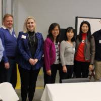 Faculty and partners pose for a photo
